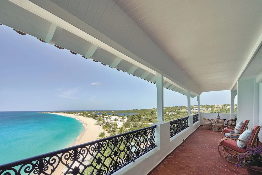 Covered balcony with ornate railings overlooking Baie Longue at La Samanna, St Martin.