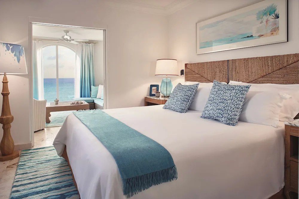 King bedroom opening to an ocean-view sitting room at La Samanna, St Martin.
