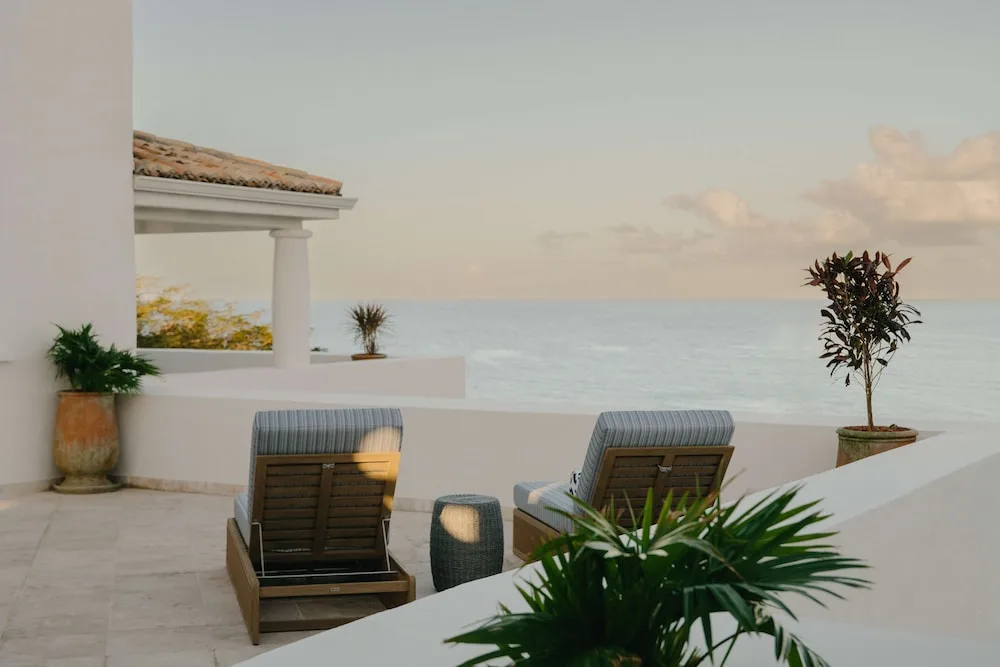 Private terrace with two loungers and ocean view at La Samanna, St Martin.