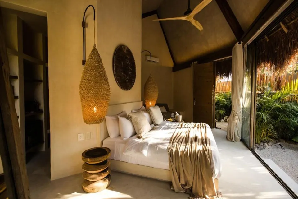 Hotel Muaré Tulum Wellness and Spa wellness boutique hotel with jungle landscaping and serene pool area in Tulum, Mexico.