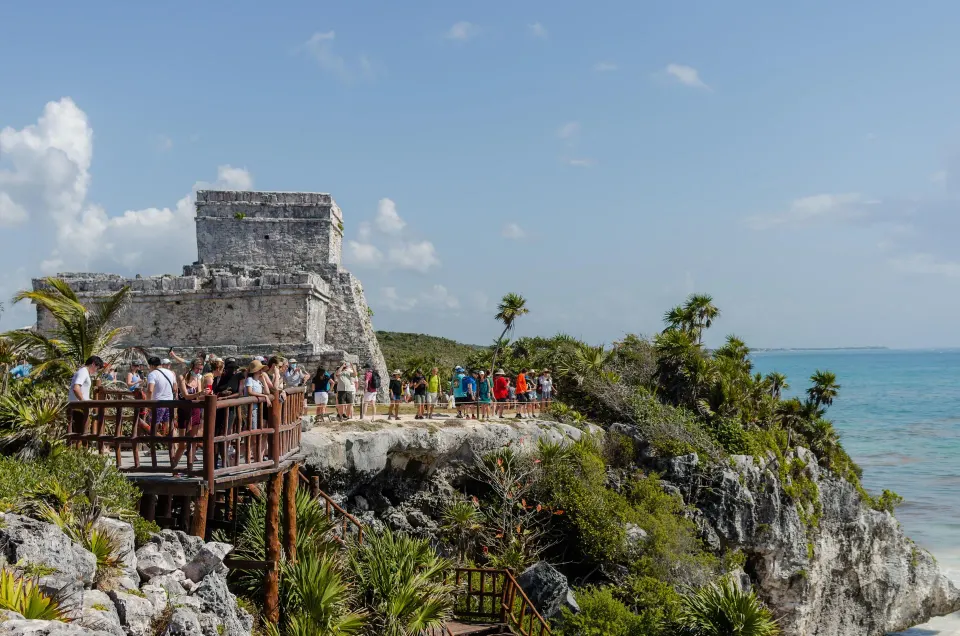 Cliffside ancient ruin and wooden walkway overlooking the sea at La Valise Tulum