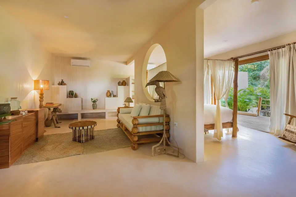 Sitting area and open-plan bedroom in Cenote Suite Lower at La Valise Tulum