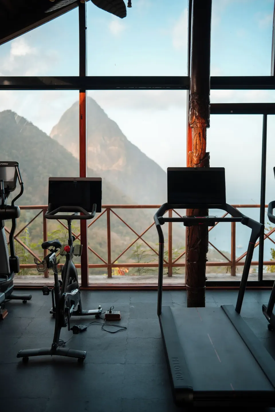 Fitness room treadmills and bike facing mountain and sea views at Ladera Resort.