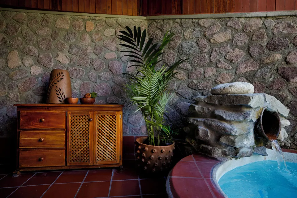 Petit Piton Suite plunge pool with stone water feature at Ladera Resort.