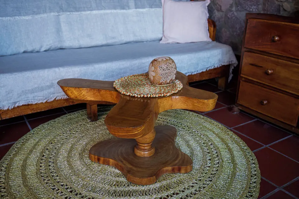 Petit Piton Suite carved coffee table and sofa at Ladera Resort.
