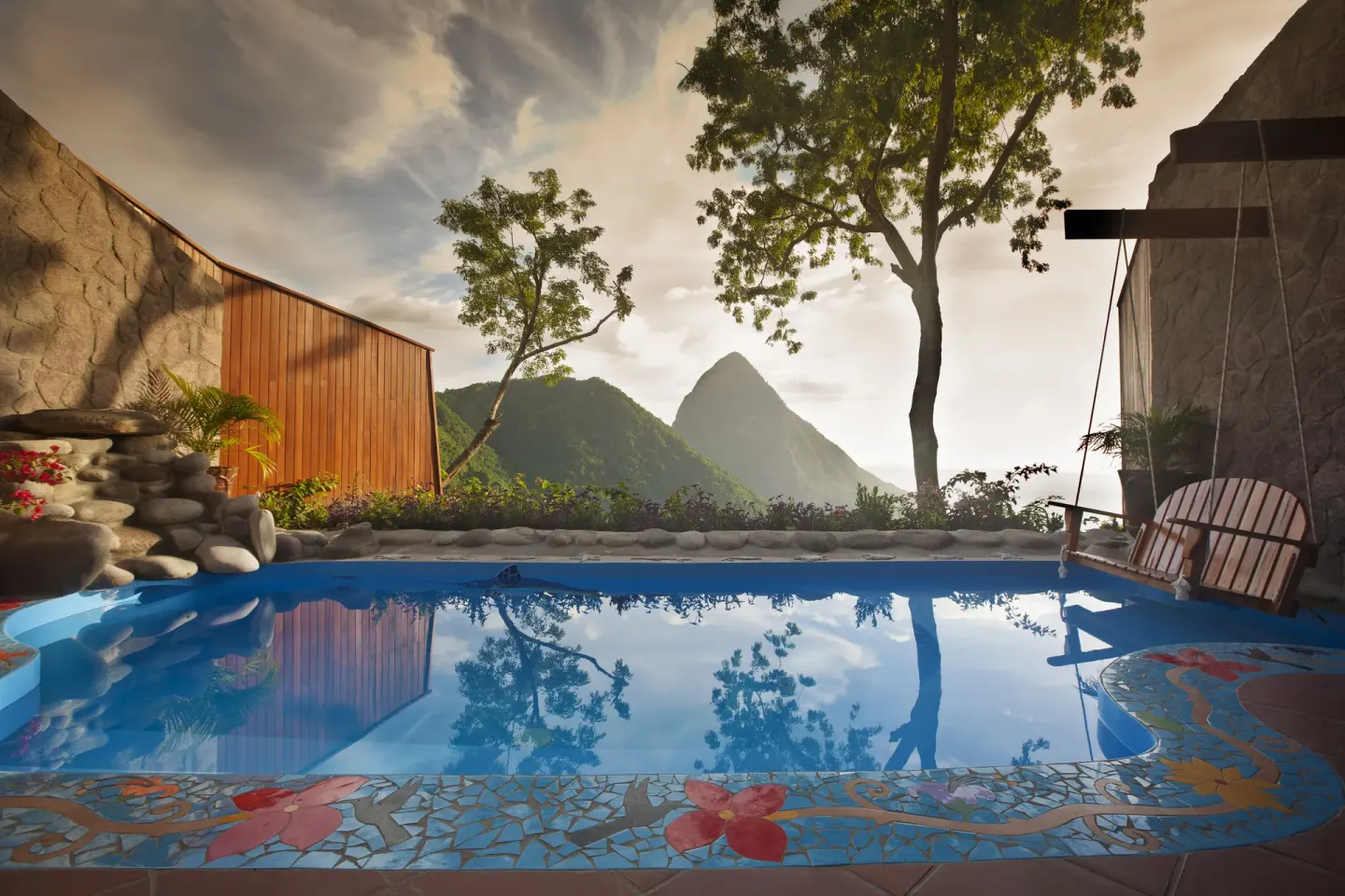 Private plunge pool at Ladera Resort with Piton mountain views and colorful mosaic tile.