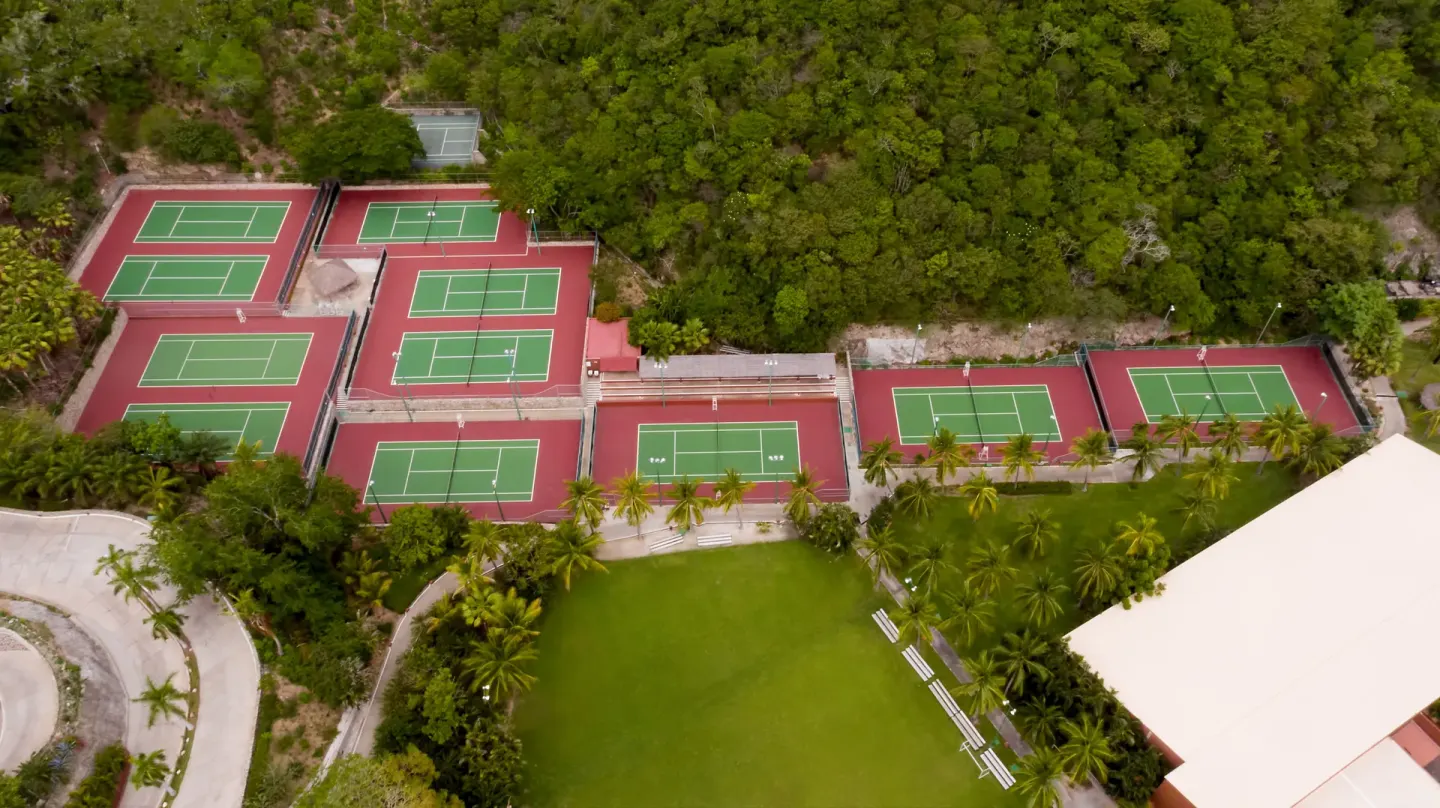 Overhead view of tennis courts and lawn at Las Brisas Huatulco.