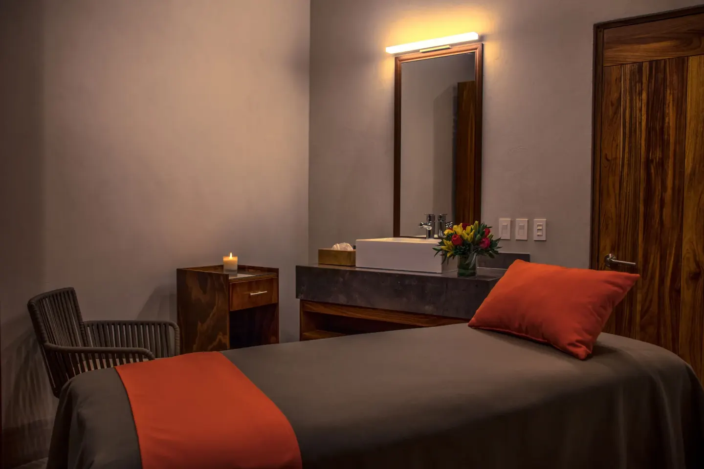 Single spa treatment bed with vanity and candle at Las Brisas Huatulco.