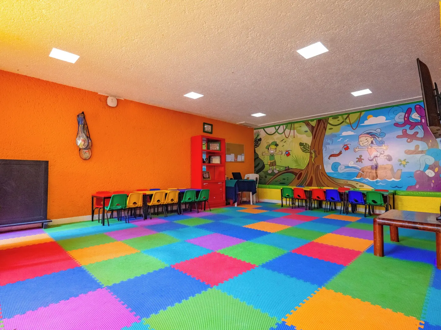 Colorful kids club room with foam floor tiles and mural artwork at Las Brisas Ixtapa.