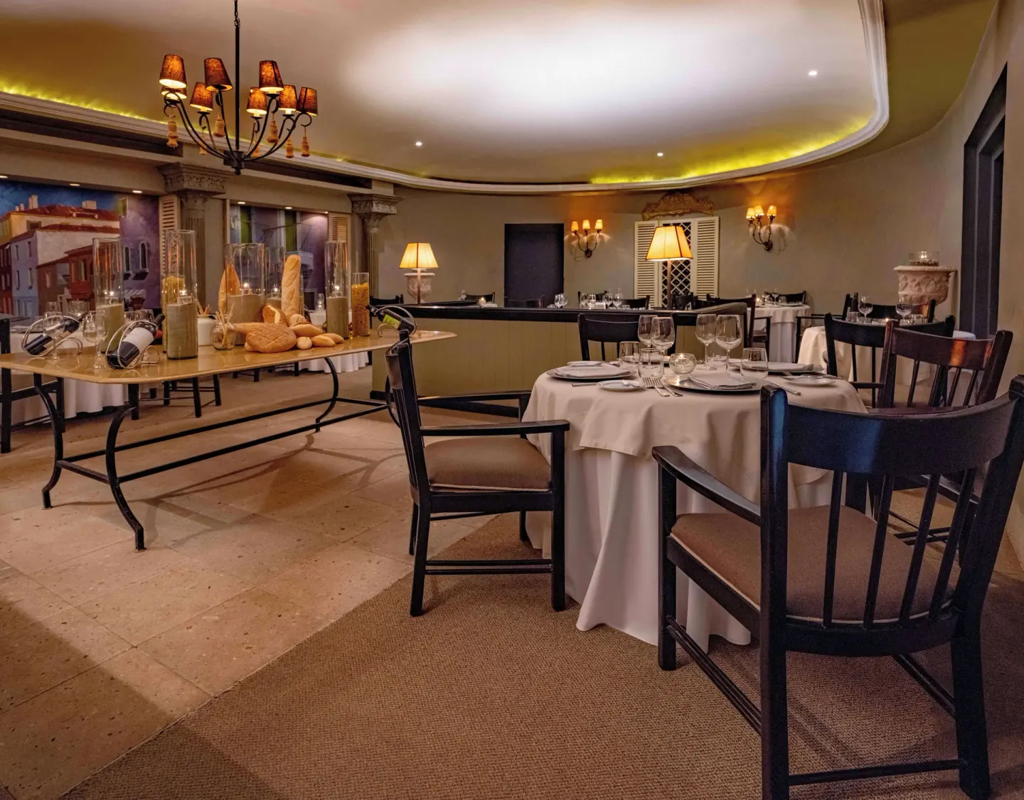 Elegant restaurant dining room with set tables and buffet display at Las Brisas Ixtapa.