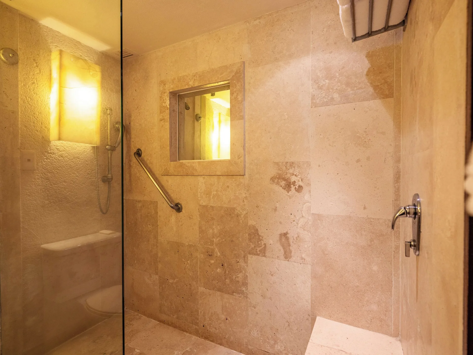 Deluxe Grand Bed stone bathroom shower area at Las Brisas Ixtapa.