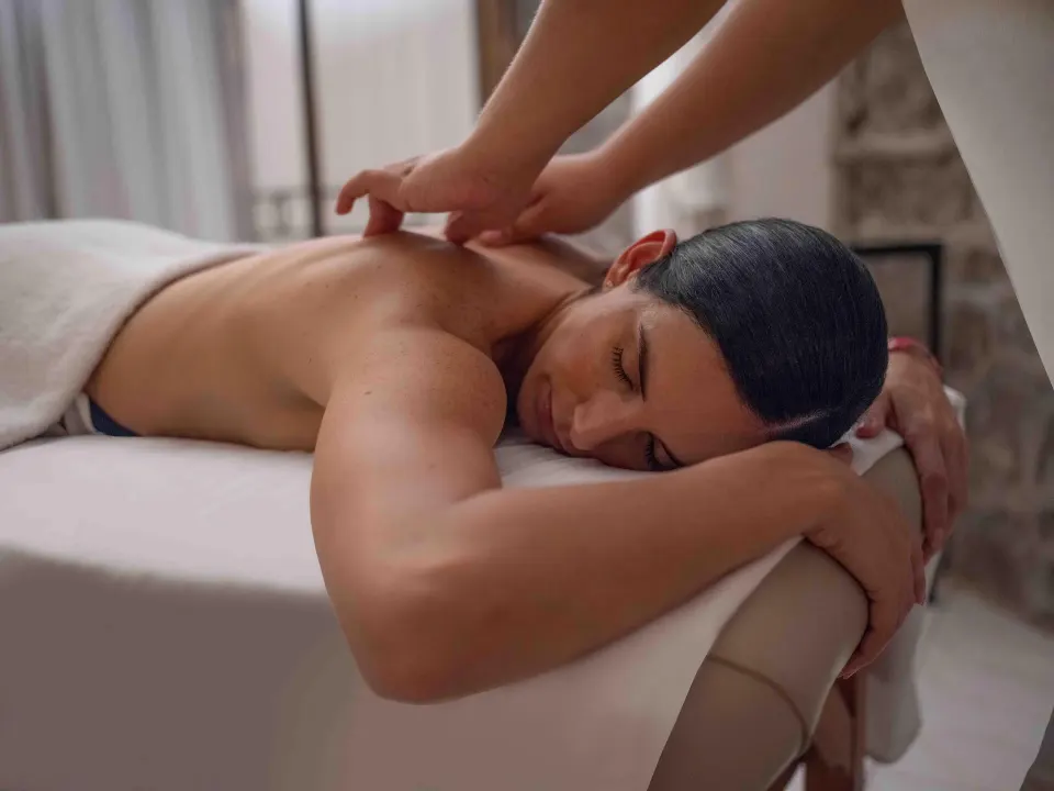 Guest receiving a massage on a treatment table at Las Hadas.