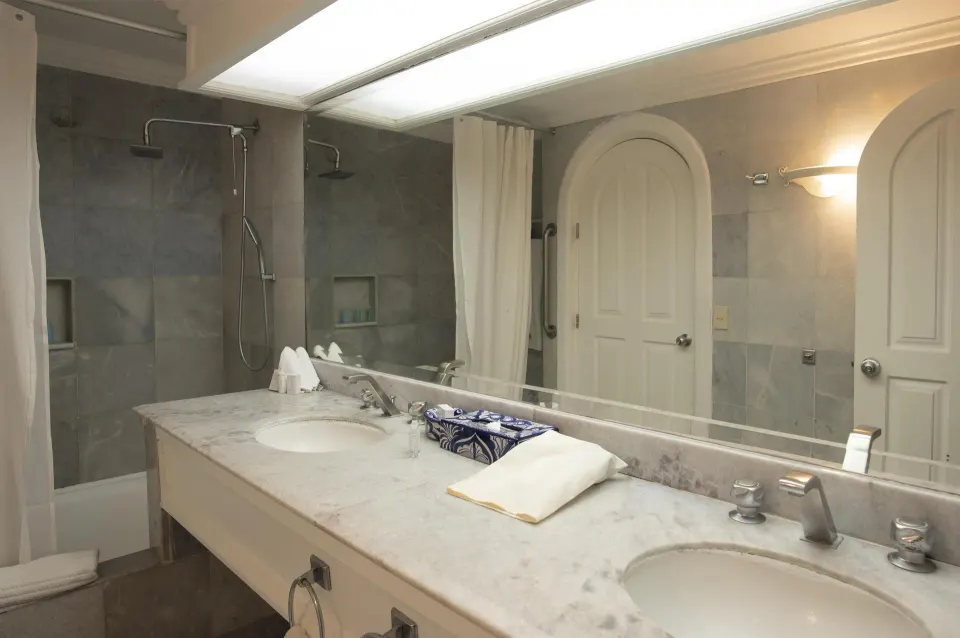 Fantasy Suite bathroom with double vanity and walk-in shower at Las Hadas.