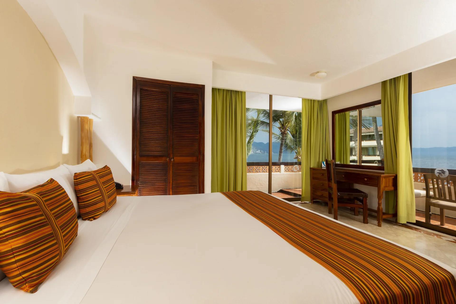 Ocean Front room with king bed and balcony view at Las Palmas by the Sea.