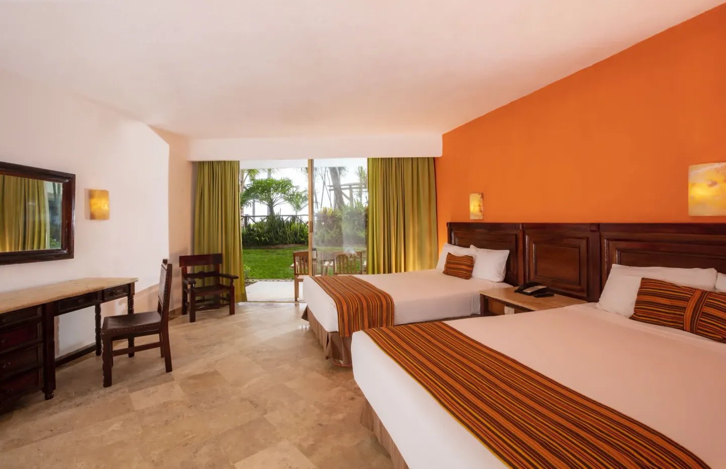 Standard room with two double beds, desk, and terrace doors at Las Palmas by the Sea.