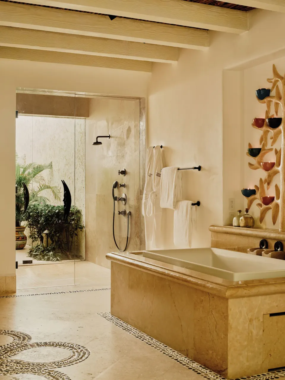 Bathroom with soaking tub, glass shower, and garden view at Las Ventanas al Paraiso.