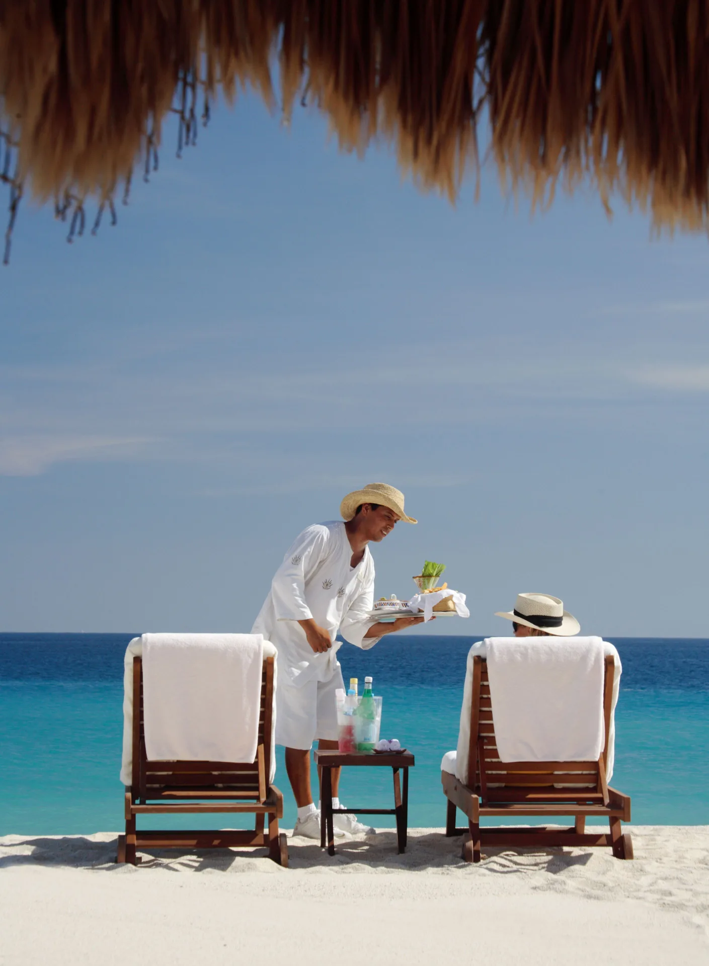 Beach service at lounge chairs beside the sea at Las Ventanas al Paraiso.