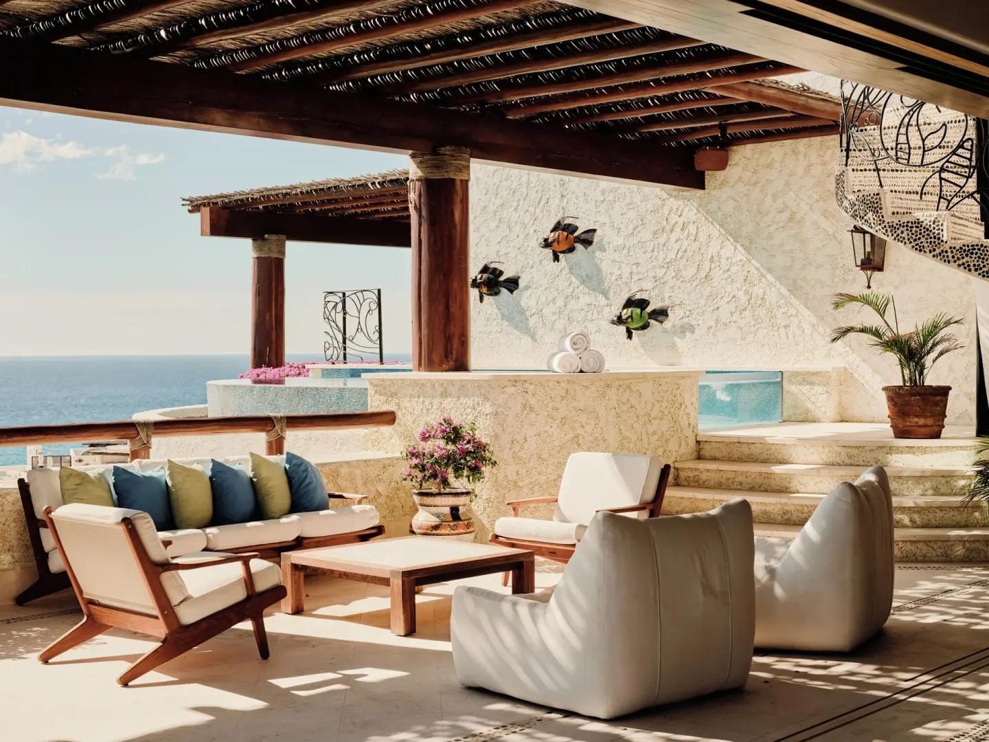 Covered terrace lounge with plunge pool and ocean view at Las Ventanas al Paraiso.