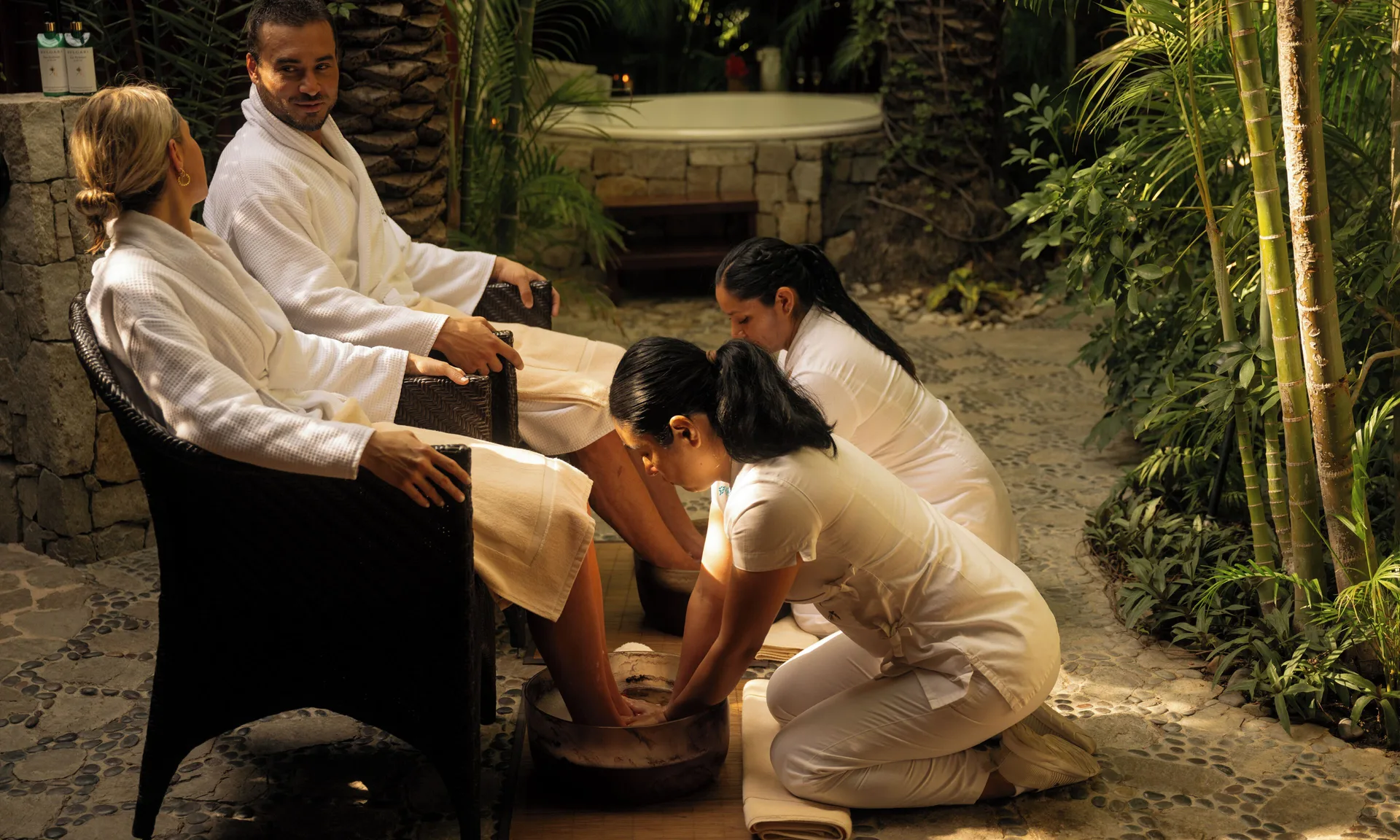 Couple receiving foot baths in a tropical spa garden at Las Ventanas al Paraiso.