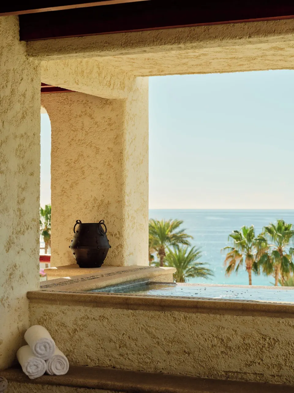 Plunge pool with rolled towels and ocean view at Las Ventanas al Paraiso.