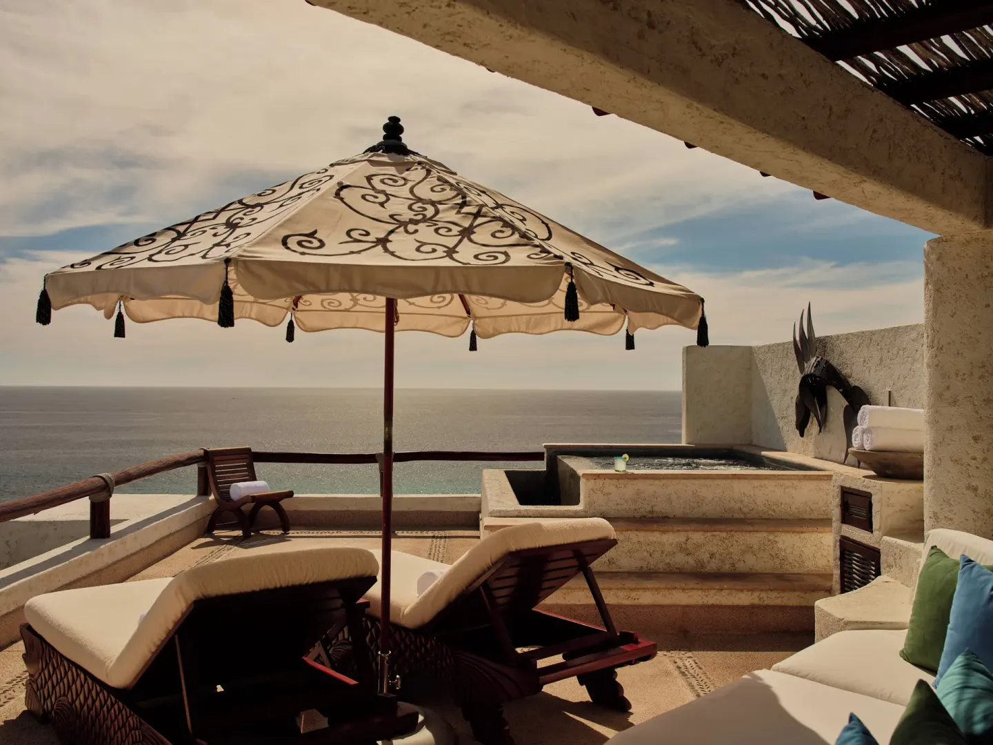 Private terrace with loungers, umbrella, plunge pool, and ocean view at Las Ventanas al Paraiso.