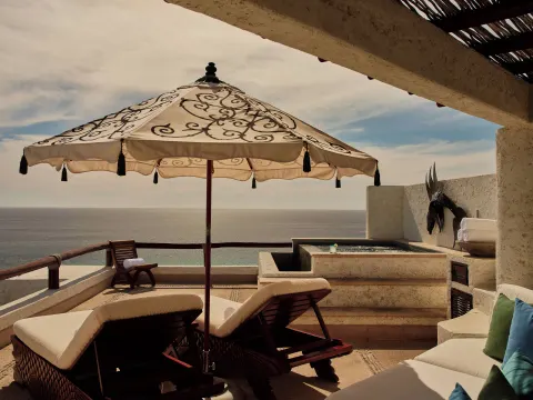 Private terrace with loungers, umbrella, plunge pool, and ocean view at Las Ventanas al Paraiso.
