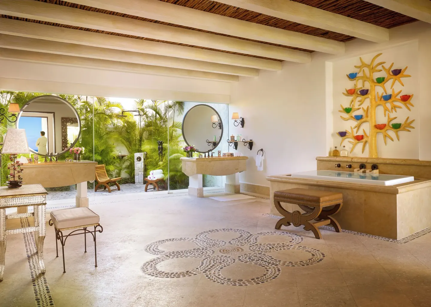 Spacious bathroom with twin vanities, soaking tub, and garden outlook at Las Ventanas al Paraiso.