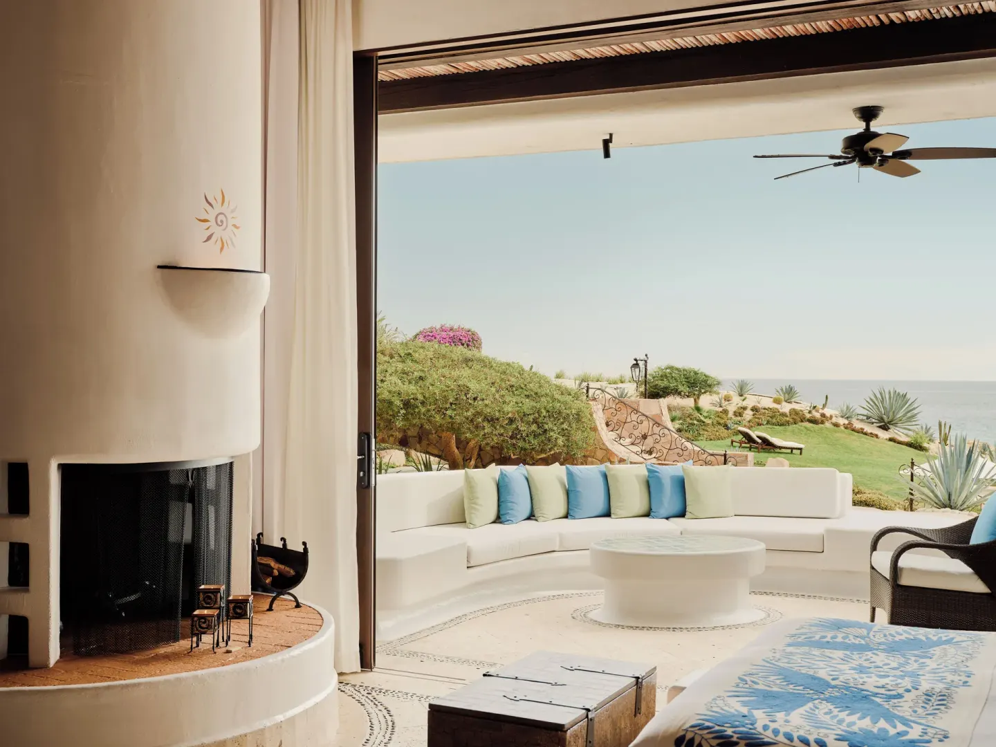 Suite terrace lounge with fireplace and ocean garden view at Las Ventanas al Paraiso.