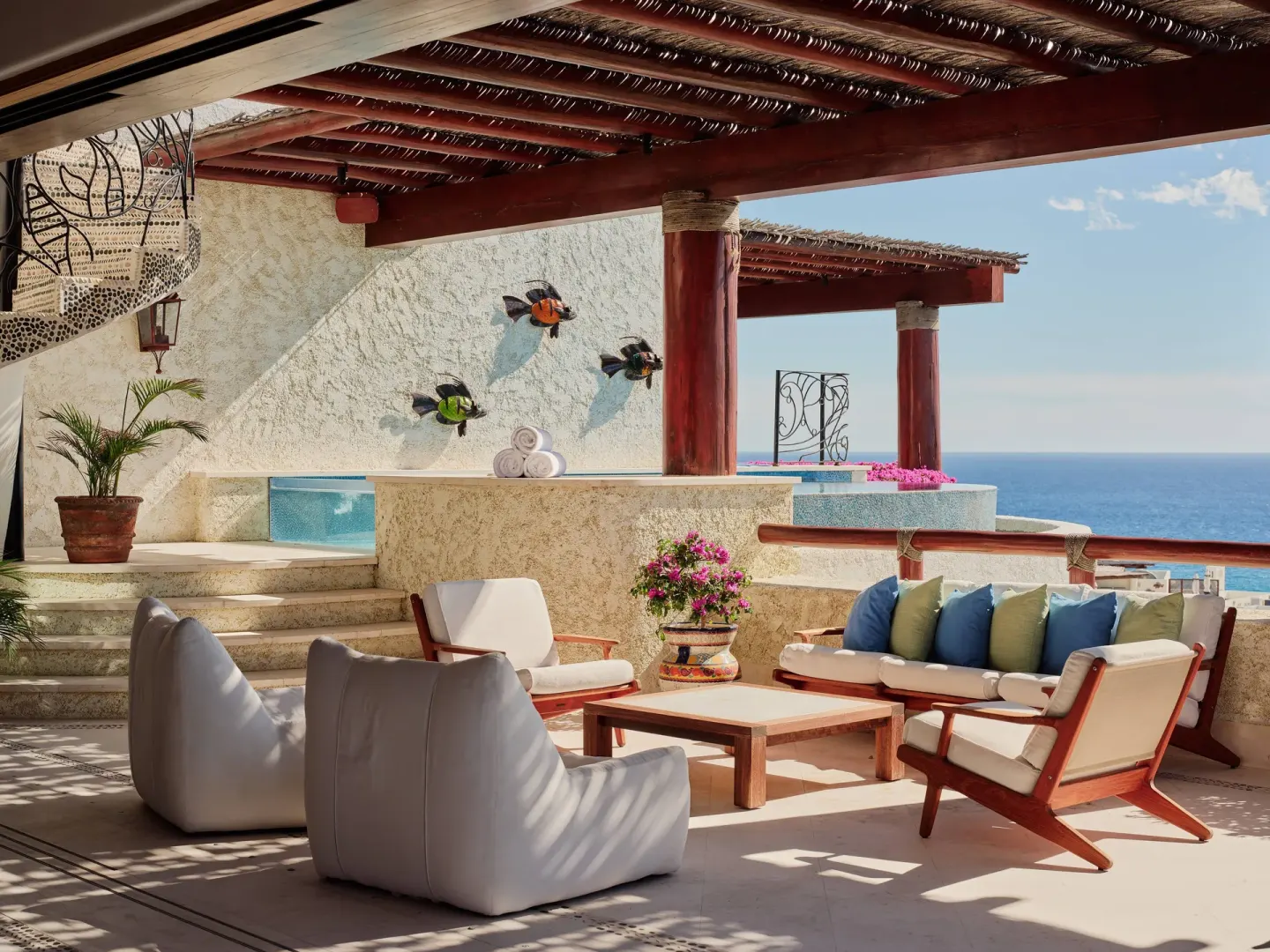 Covered terrace lounge with plunge pool and ocean view at Las Ventanas al Paraiso.