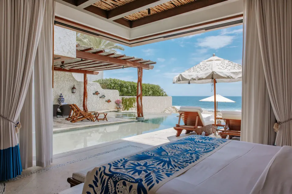 King bed facing a private pool and ocean at Las Ventanas al Paraiso.