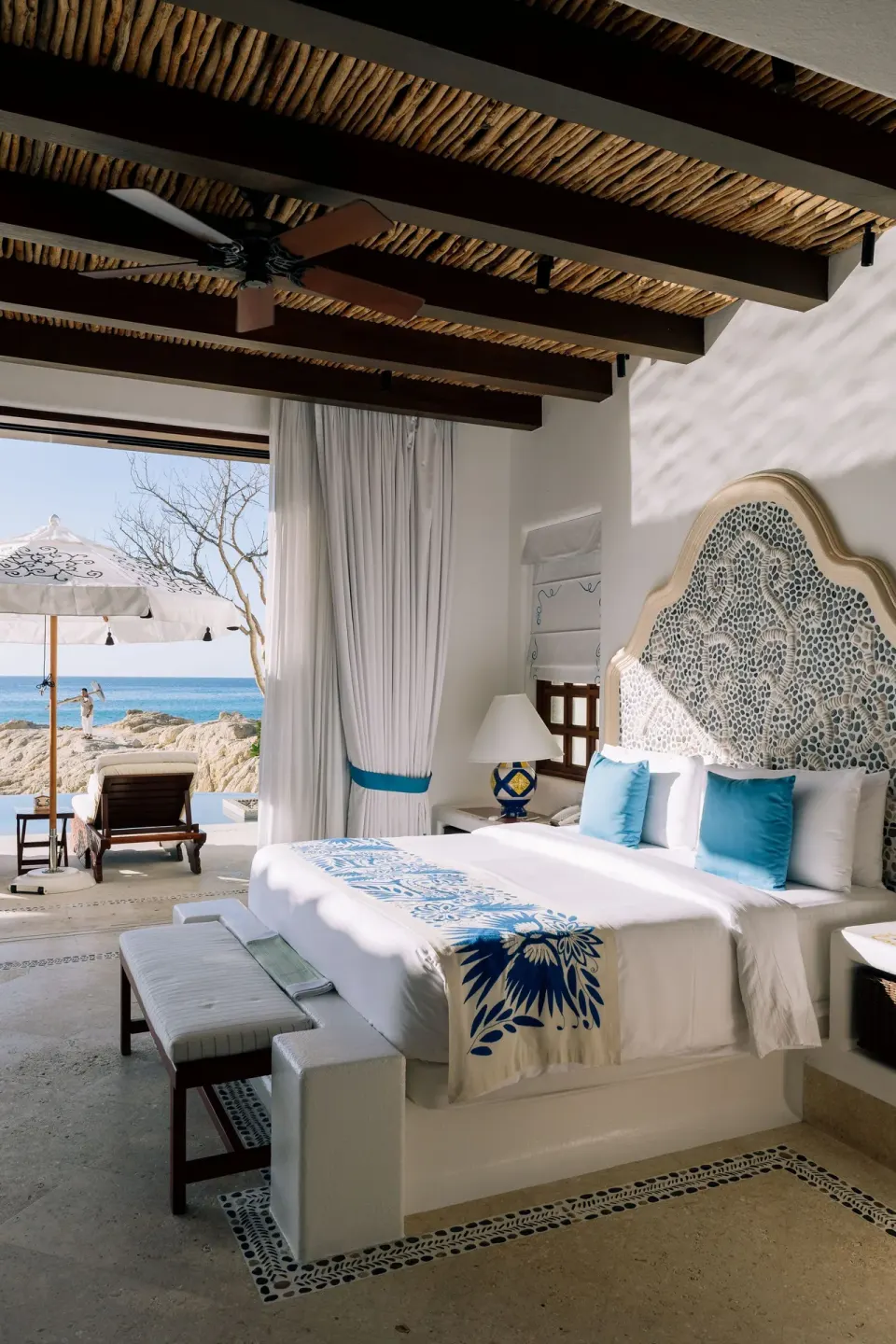 King bed and oceanfront terrace in a villa bedroom at Las Ventanas al Paraiso.