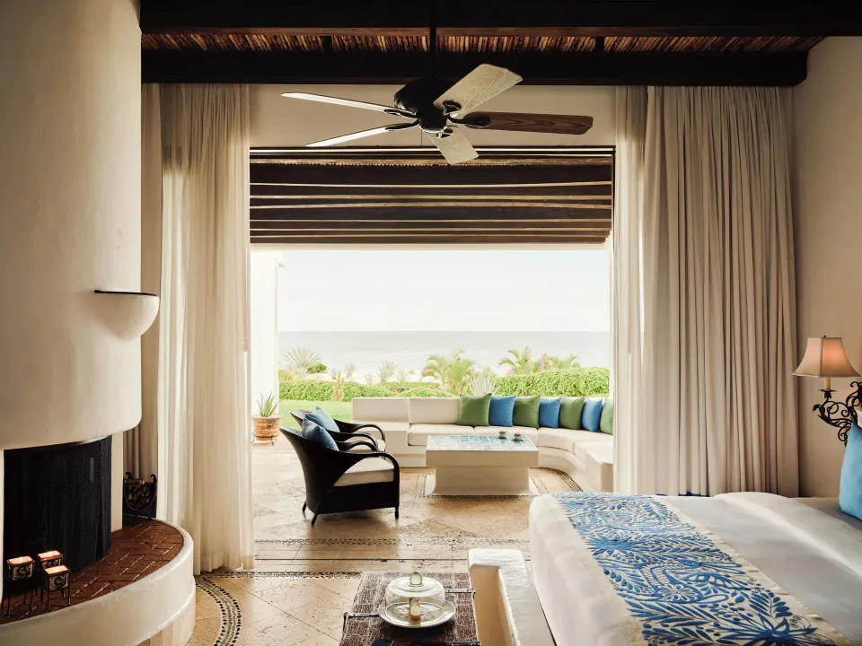 Ocean Front Junior Suite king bed, fireplace, and terrace at Las Ventanas al Paraiso.