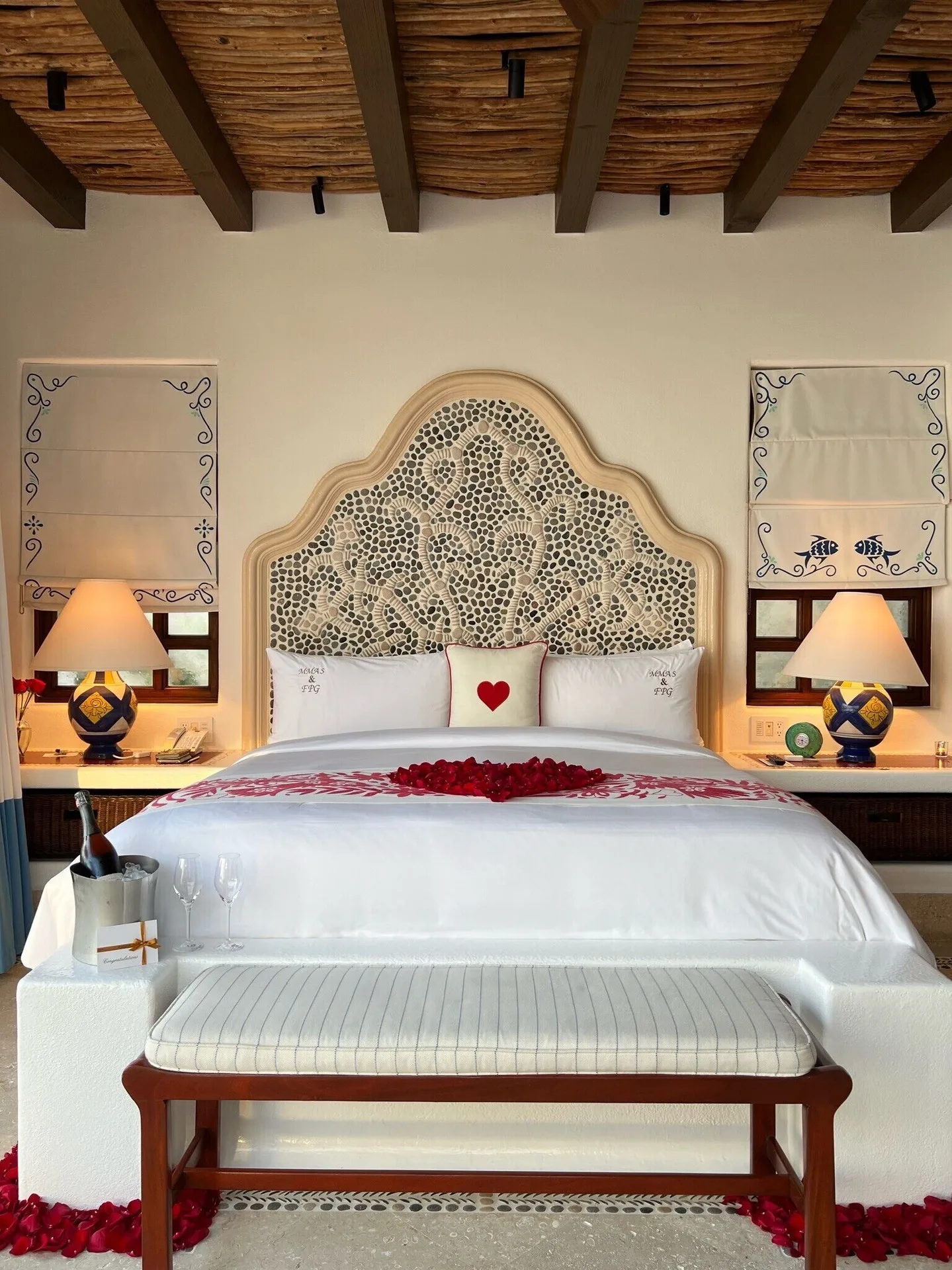 Oceanview Junior Suite king bed with rose petals at Las Ventanas al Paraiso.
