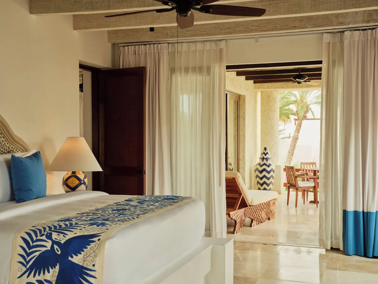 Bedroom and terrace of a One Bedroom Garden View Residence at Las Ventanas al Paraiso.