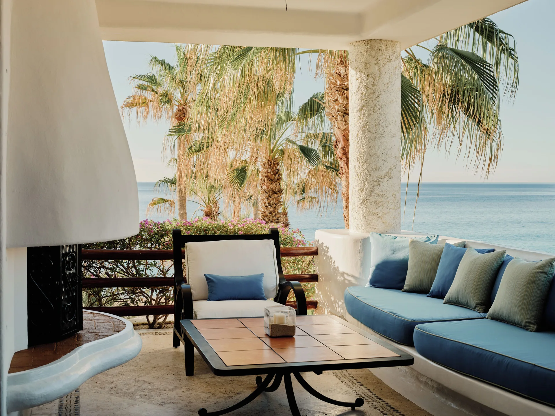 Terrace of a One Bedroom Oceanview Residence at Las Ventanas al Paraiso facing palms and ocean.