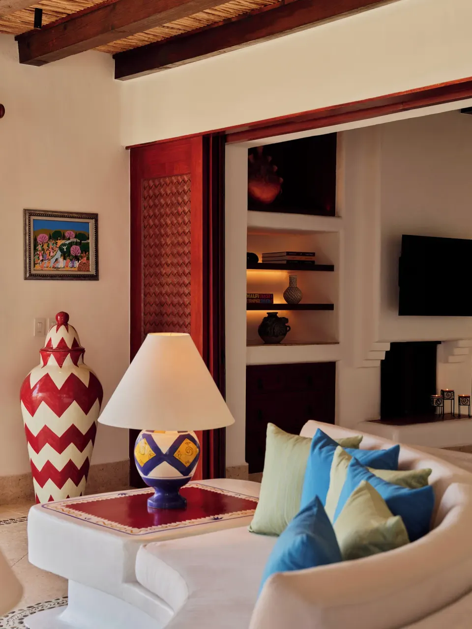 One Bedroom Oceanview Villa living area with sofa and fireplace at Las Ventanas al Paraiso.