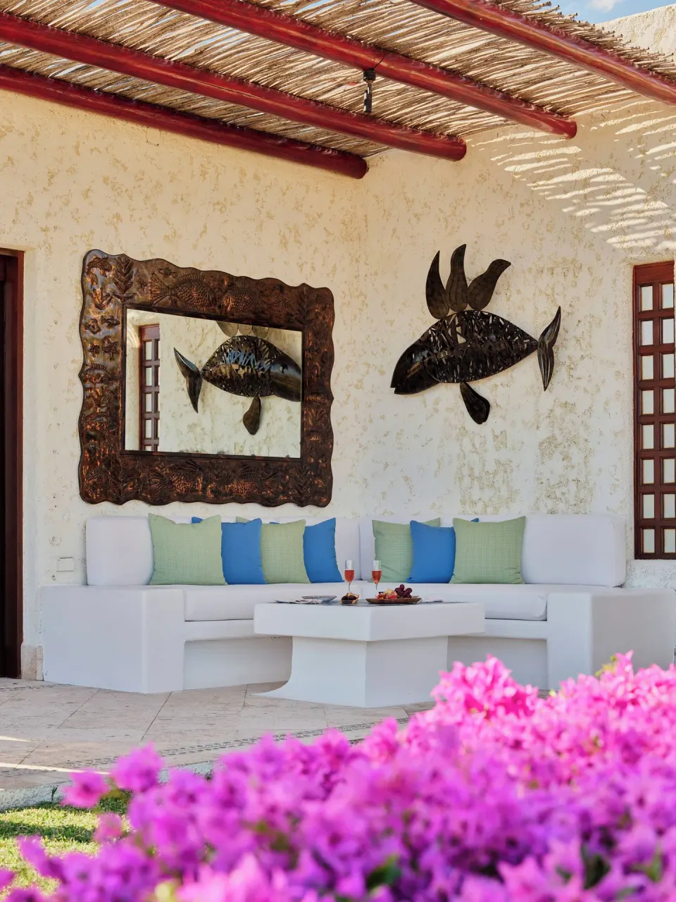One Bedroom Oceanview Villa terrace seating with fish artwork at Las Ventanas al Paraiso.