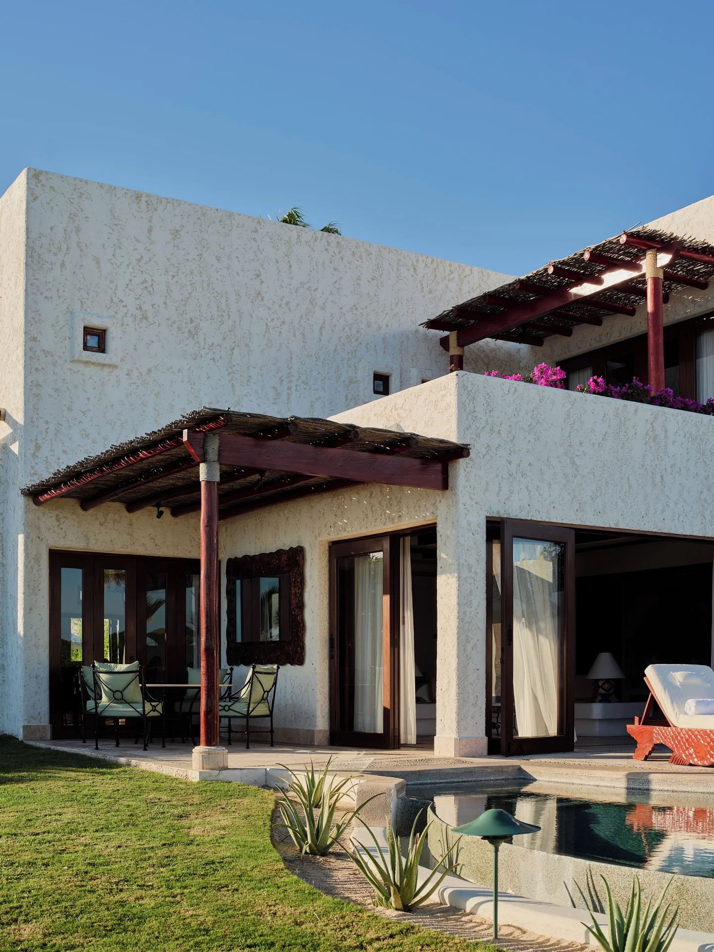 Three Bedroom Oceanview Villa exterior at Las Ventanas al Paraiso with terrace, lawn, and plunge pool.