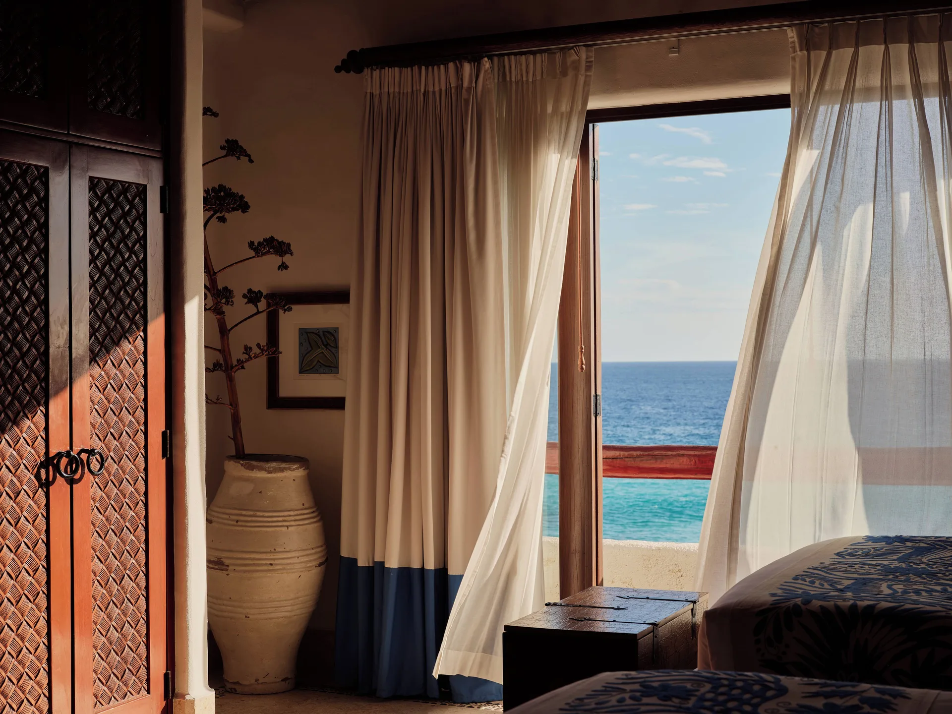 Three-Bedroom Oceanview Villa bedroom with ocean-facing doors at Las Ventanas al Paraiso.