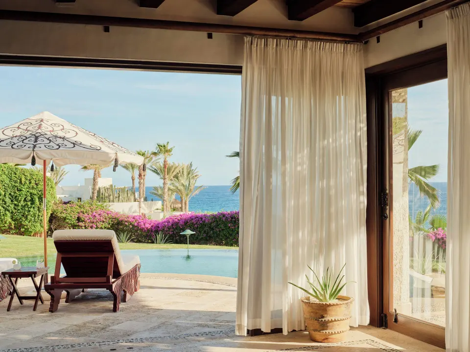 Three Bedroom Oceanview Villa terrace at Las Ventanas al Paraiso with pool, lounger, umbrella, and ocean.
