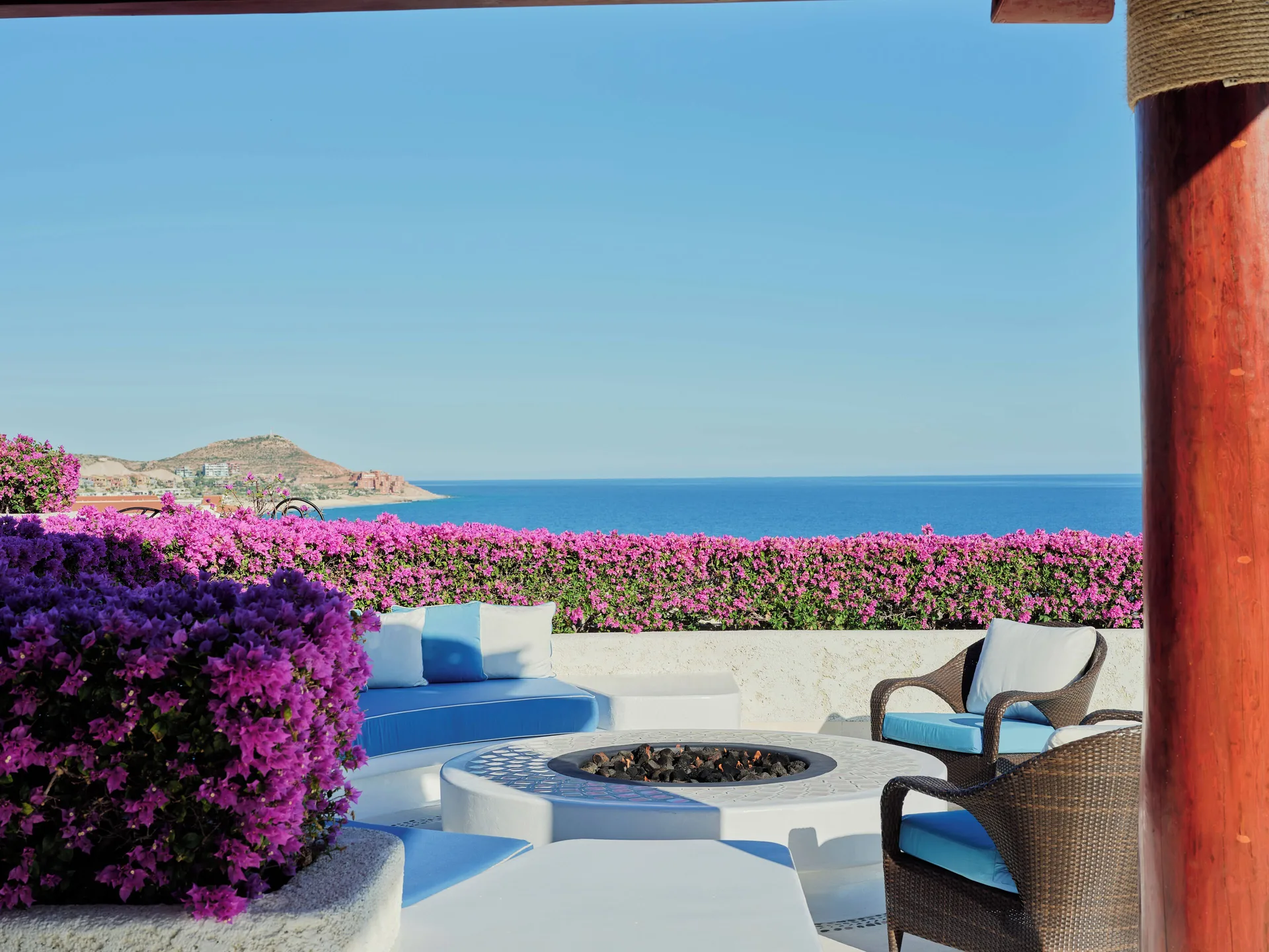 Rooftop seating terrace with fire pit and ocean view at Las Ventanas al Paraiso.