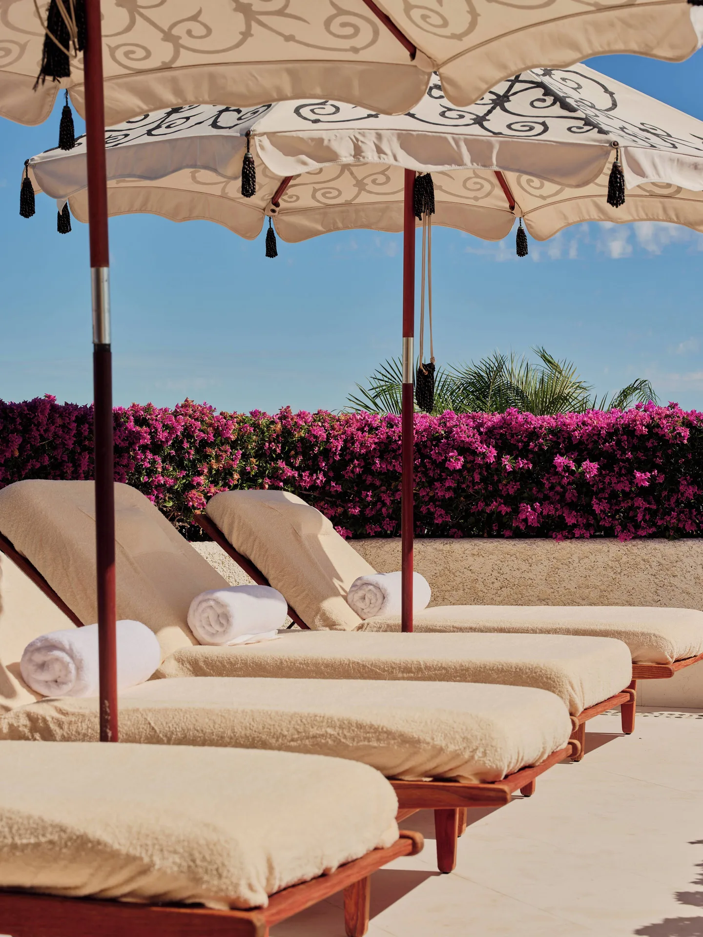 Rooftop lounge chairs under umbrellas at Las Ventanas al Paraiso.