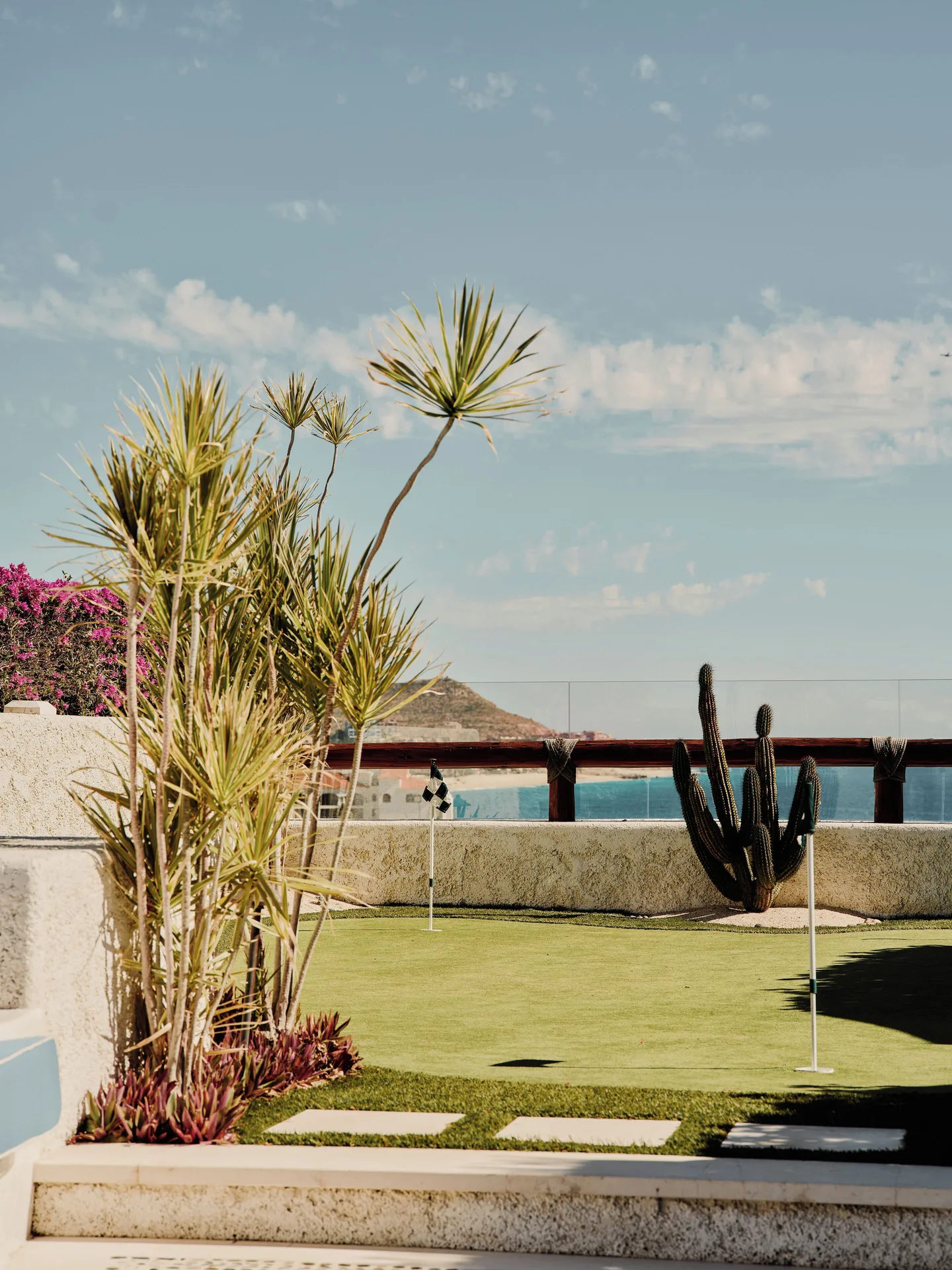 Putting green with cactus garden and ocean beyond at Las Ventanas al Paraiso.