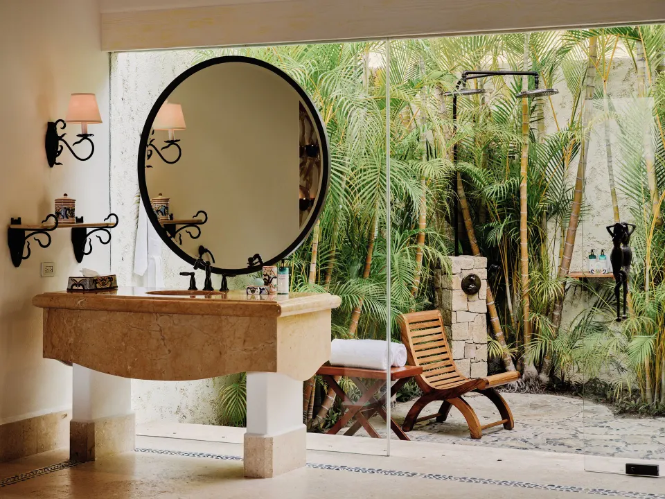 Villa bathroom vanity opening to an outdoor shower garden at Las Ventanas al Paraiso.