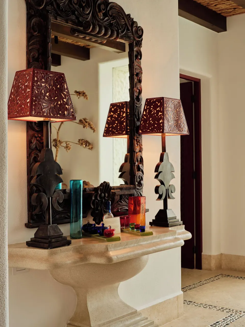 Decorative vanity mirror and lamps in a villa room at Las Ventanas al Paraiso.