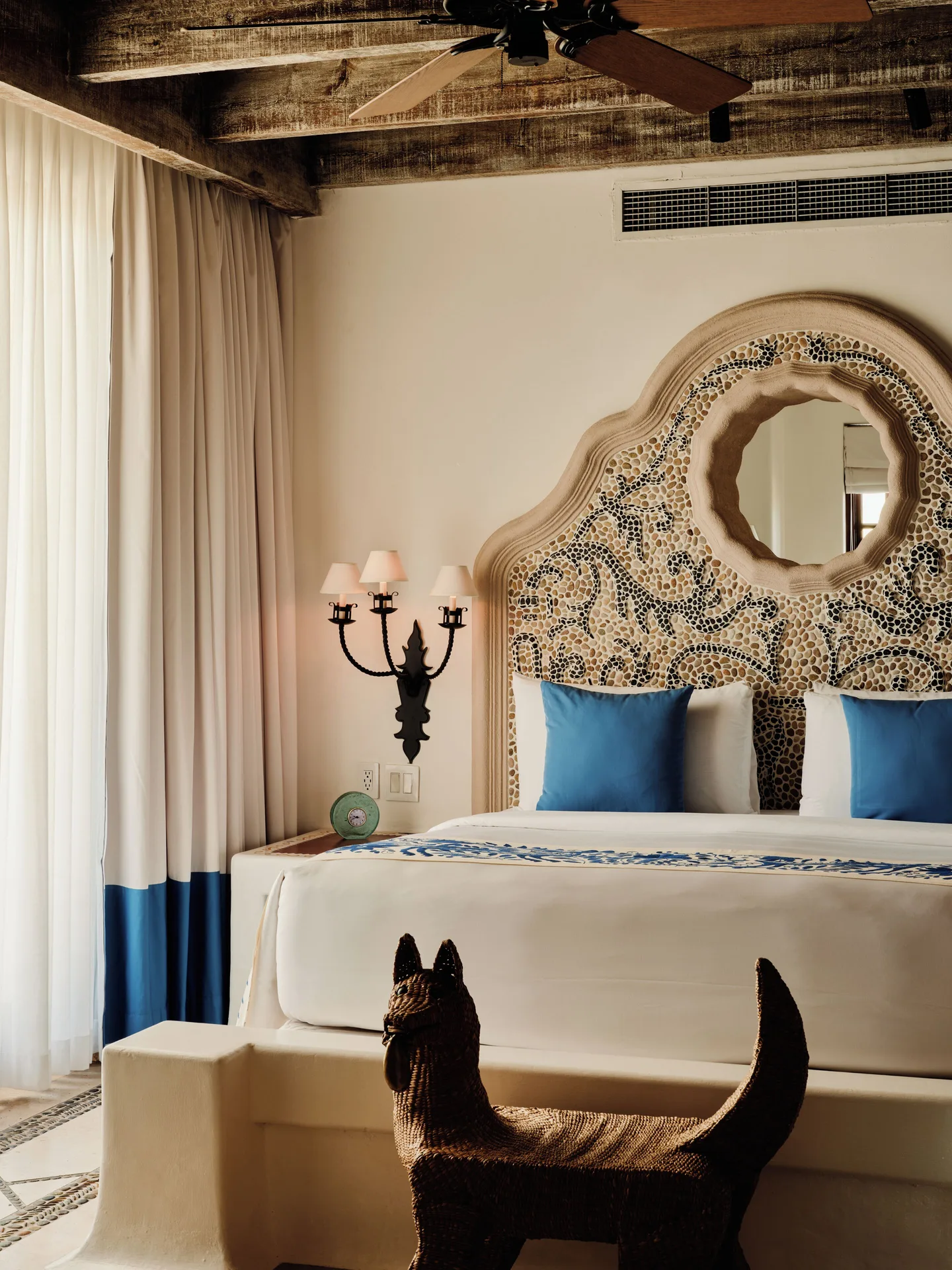 Mosaic headboard and bed in the Two Bedroom Ty Warner Penthouse at Las Ventanas al Paraiso.