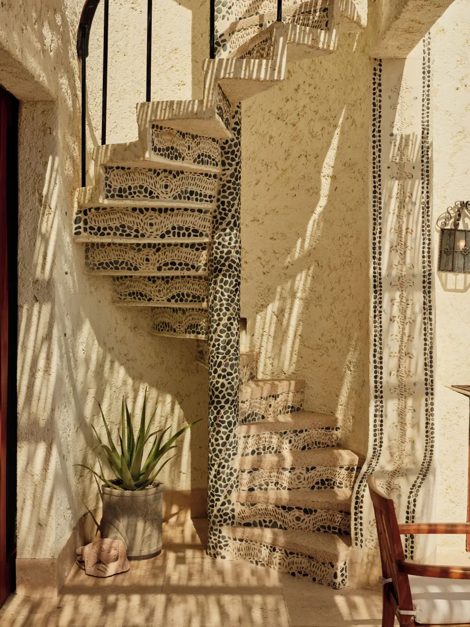 Mosaic spiral staircase in the Two Bedroom Ty Warner Penthouse at Las Ventanas al Paraiso.