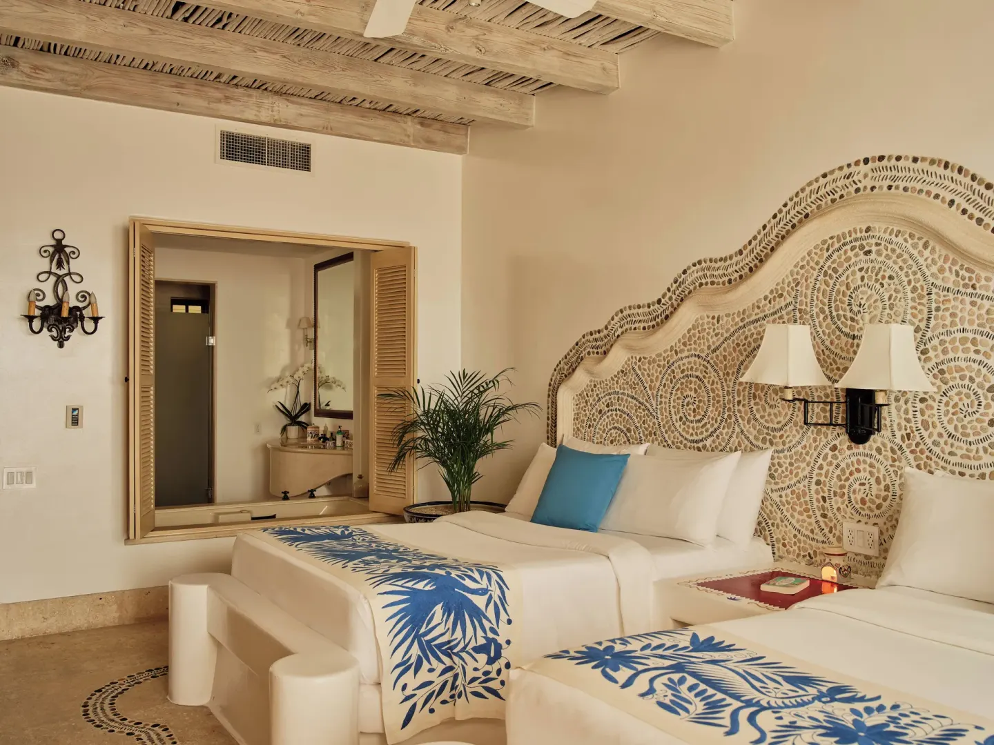 Twin beds with mosaic headboard in the Two Bedroom Ty Warner Penthouse at Las Ventanas al Paraiso.