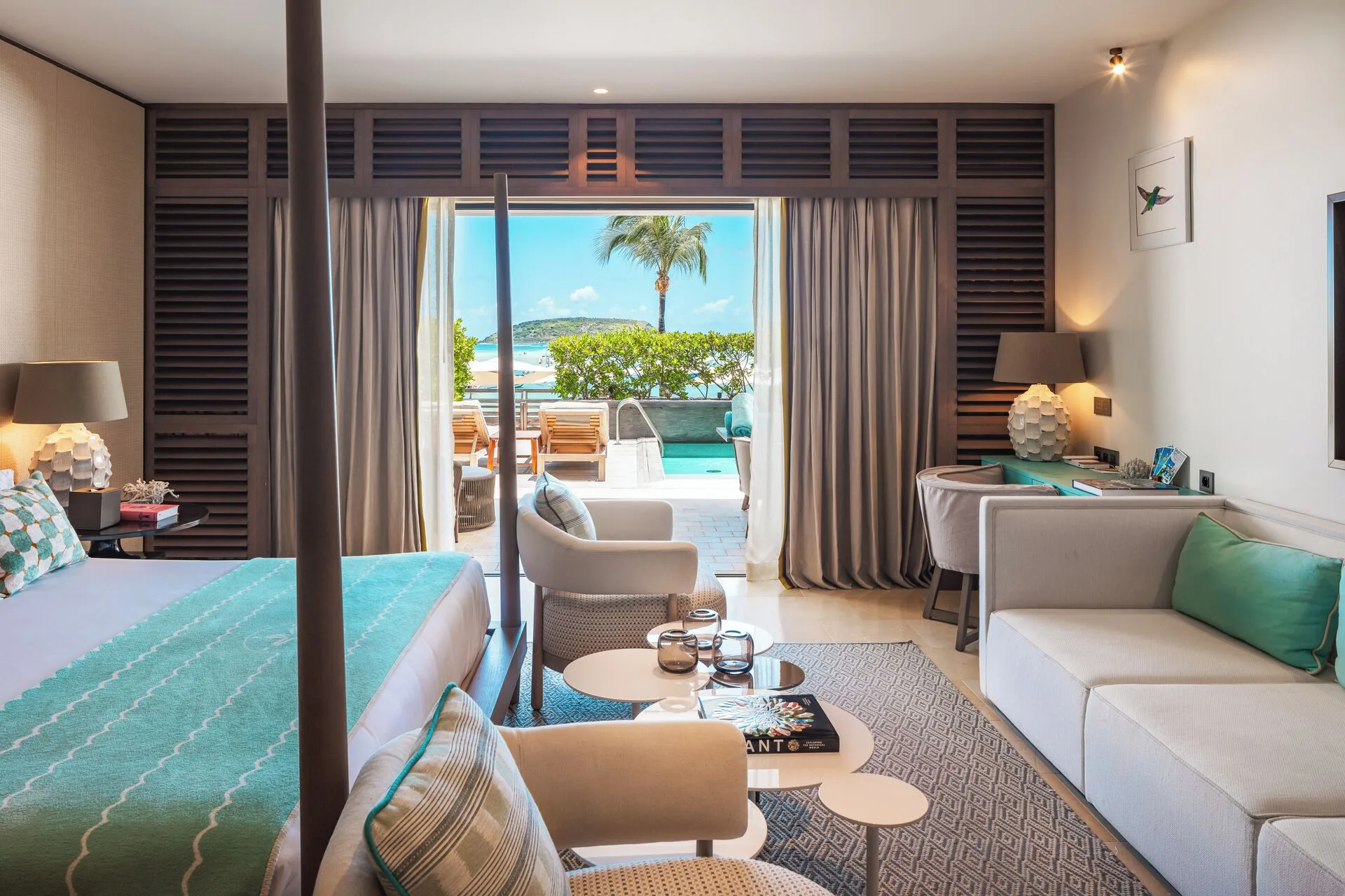 La Suite Océan Piscine Privée guest room with king bed and terrace at Le Barthélemy Hotel & Spa.