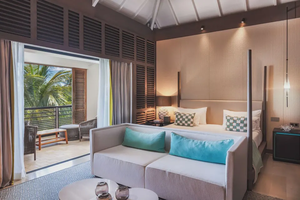 Ocean Signature Suite bedroom with king bed and open terrace at Le Barthélemy Hotel & Spa.